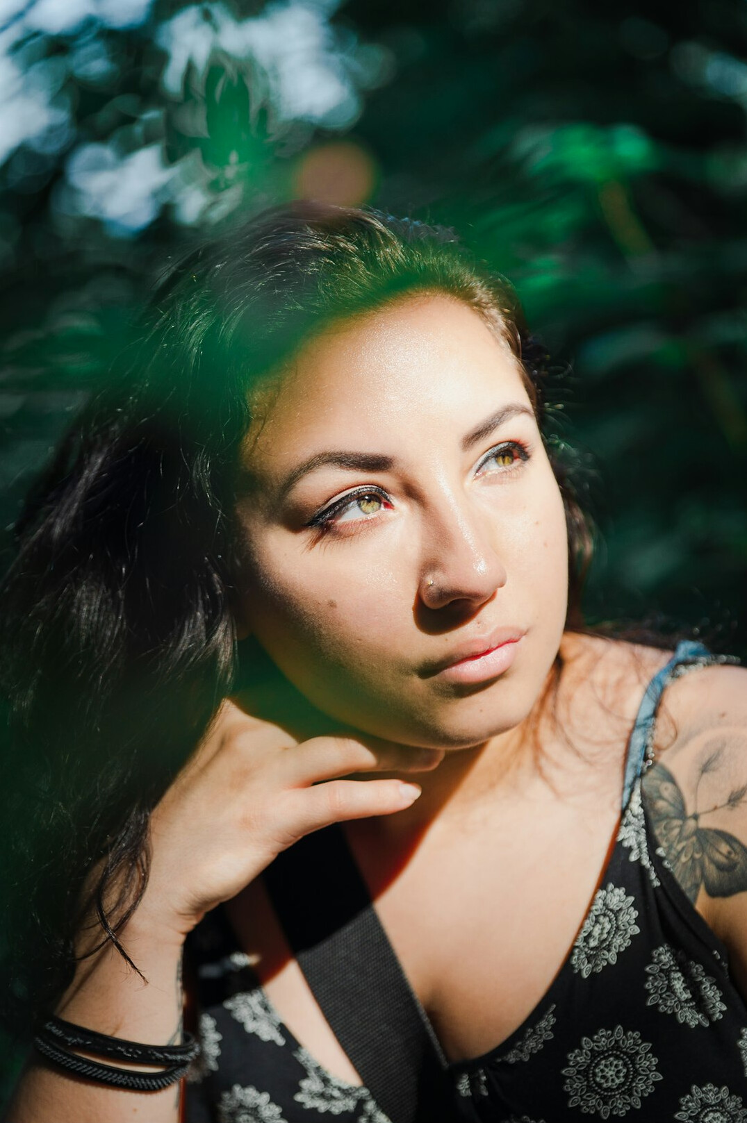 Portrait of a woman with dark hair looking at the camera