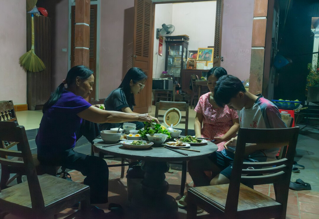 Group of young adults studying together at a table