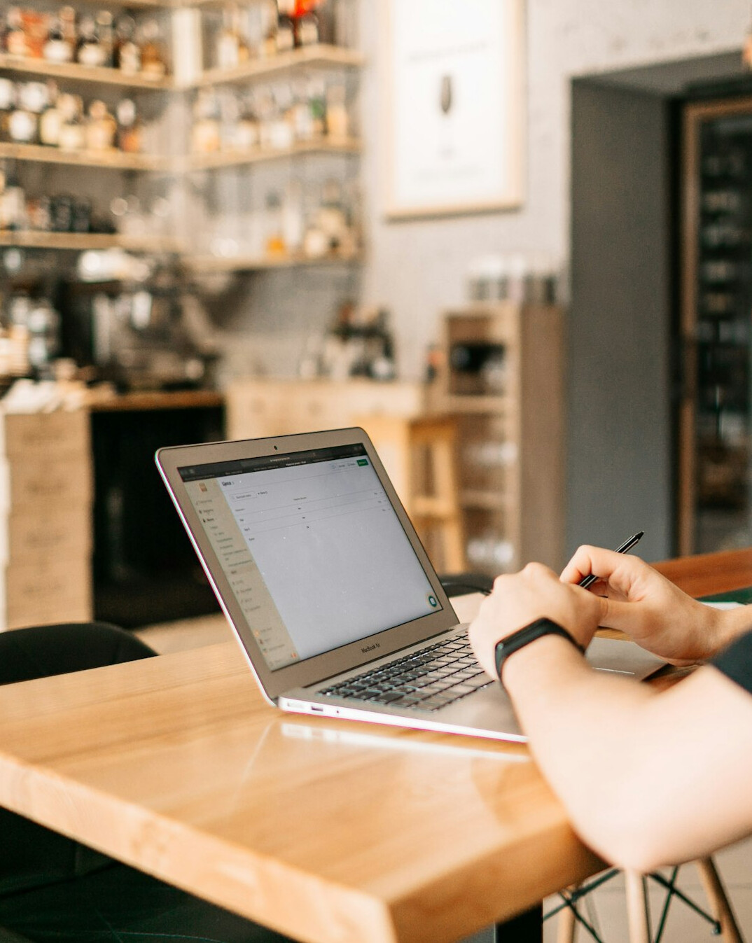 person writing business plan on laptop