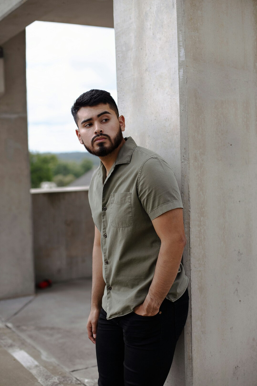Portrait of a man with a short beard in a casual shirt