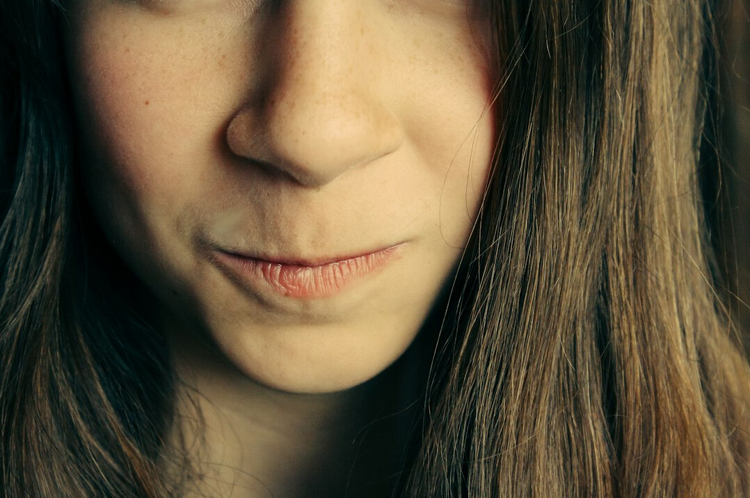 Portrait of a young woman with a gentle smile