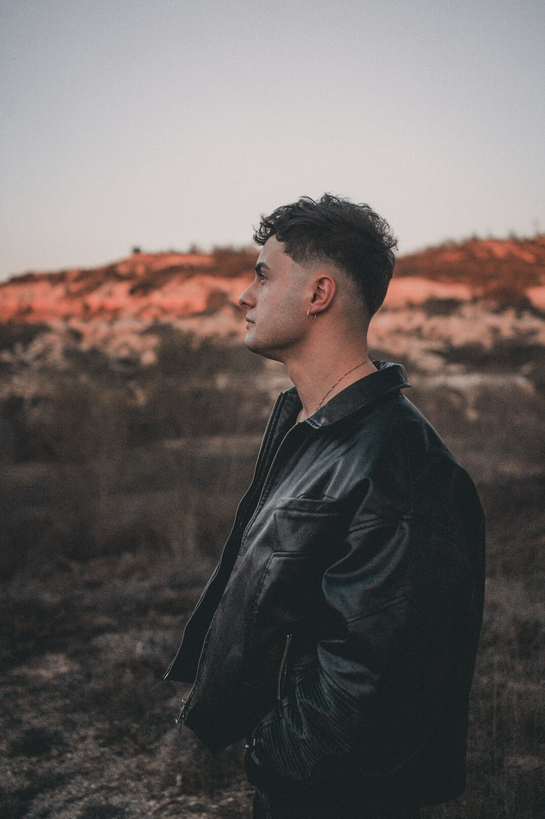 Portrait of a man in a dark jacket with short hair